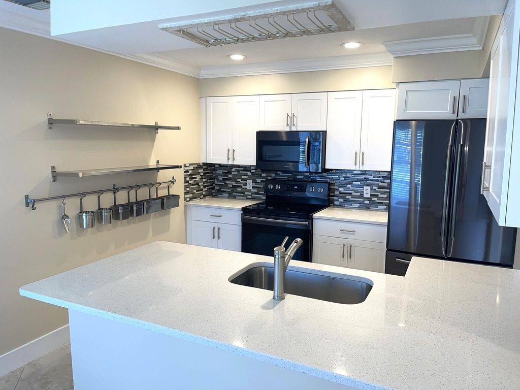 Photo of 1447 Lake Mango Way, West Palm Beach, FL 33406 (MLS # R11013058)