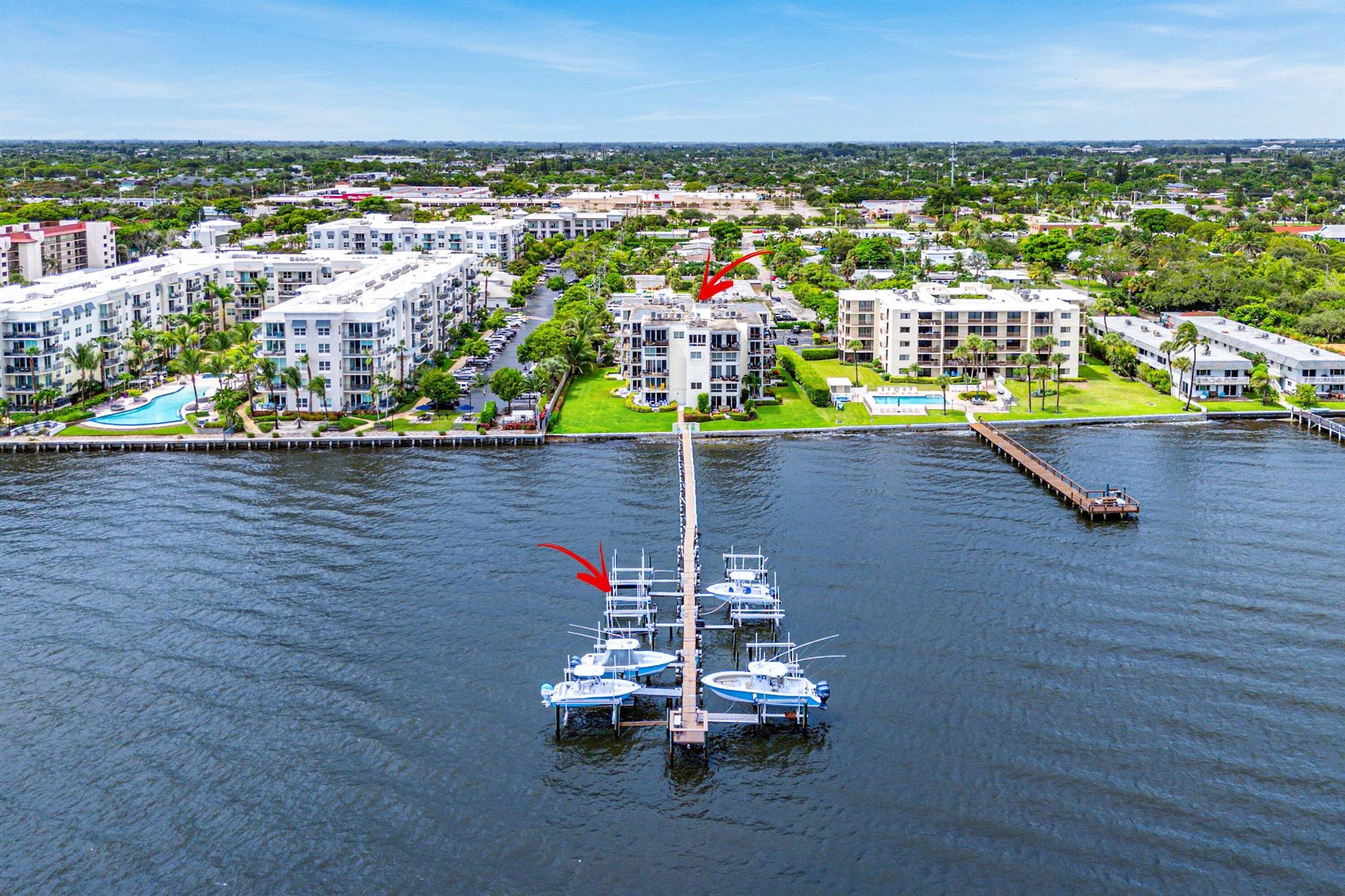 Experience premier waterfront living in this impeccably renovated 2-bedroom, 2-bathroom Intracoastal condo with 1 car garage, complete with a boat slip and unobstructed ocean access with no fixed bridges. A rare offering, this second-floor residence delivers breathtaking water views and a lifestyle tailored for boating enthusiasts, right from your doorstep.As soon as you enter, you'll notice the extensive updates throughout. Step inside to find beautifully laid wood-look tile flooring flowing through the entire space, complemented by modern recessed lighting, updated fixtures, custom trim, and impact windows.The kitchen is a showpiece, equipped with solid wood shaker cabinetry with soft-close hinges, a classic white subway tile backsplash, and stunning Calacatta quartz countertops