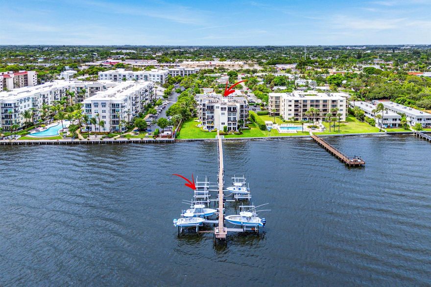 Experience premier waterfront living in this impeccably renovated 2-bedroom, 2-bathroom Intracoastal condo with 1 car garage, complete with a boat slip and unobstructed ocean access with no fixed bridges. A rare offering, this second-floor residence delivers breathtaking water views and a lifestyle tailored for boating enthusiasts, right from your doorstep.As soon as you enter, you'll notice the extensive updates throughout. Step inside to find beautifully laid wood-look tile flooring flowing through the entire space, complemented by modern recessed lighting, updated fixtures, custom trim, and impact windows.The kitchen is a showpiece, equipped with solid wood shaker cabinetry with soft-close hinges, a classic white subway tile backsplash, and stunning Calacatta quartz countertops