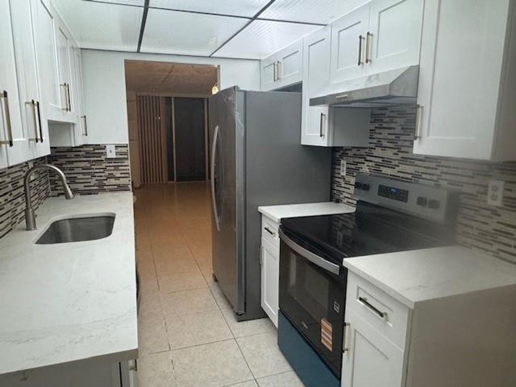 Photo of 3161 NW 47th Terrace #313, Lauderdale Lakes, FL 33319 (MLS # F10542926)