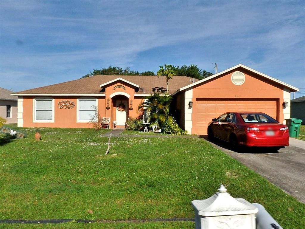 Photo of 991 SW Jasper Avenue, Port Saint Lucie, FL 34953 (MLS # R10740438)