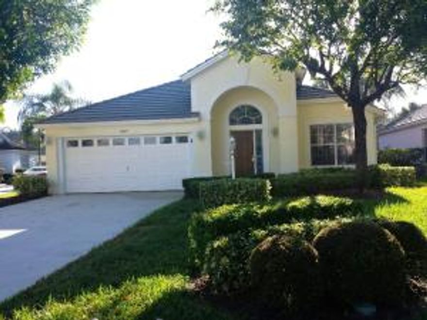 Beautifully renovated home with wood floors and plantation shutters throughout! Spacious kitchen with new stainless steel appliances, granite countertops, separate island & bar, large pantry & new kitchen lighting & fixtures. Freshly painted & pressure cleaned, large family room, separate laundry room and updated master bath. (3rd bedroom has wood floors covered by carpet which can be removed). French doors leading out to screened & covered patio from both master bedroom & family room. Enchanting & private backyard, fully fenced with wood decking & lovely landscaping! This beauty is a MUST SEE!!