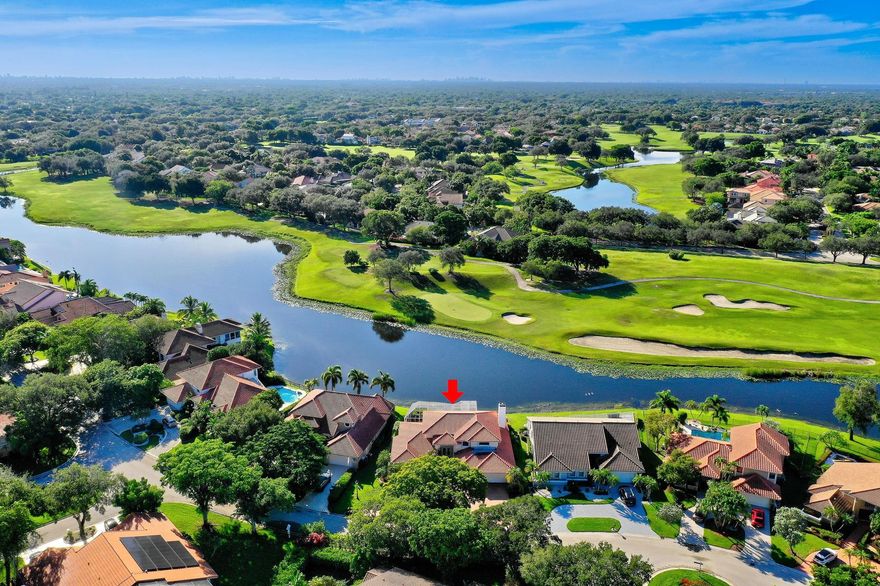 Whether you’re an avid golfer, a fitness enthusiast, or simply savor an elevated lifestyle, Eagle Trace delivers it all. Behind the manned security gate, a remarkable 5BR/3.5BA residence radiates luxury.  Inside, the home has been fully upgraded to deliver modern elegance and comfort. The spacious, open layout seamlessly connects formal and casual living areas, ideal for both everyday life and entertaining. Large windows frame breathtaking water views and the lush fairways of the privately owned course’s 4th tee. A two-story screened-in pool & spa create a private oasis for unwinding or hosting memorable gatherings. The home features a Gas Generac Generator System for peace of mind. The desirable triple-split bedroom layout offers exceptional privacy for family and guest. Low HOA fee.
