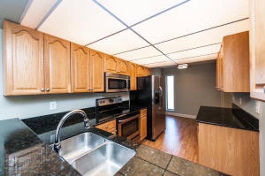 Come enjoy the best of South Florida Living in the beautiful gated community of Boca Bayou on the intra-coastal. This all age development offers multiple grill and picnic areas, multiple pools, docks for rent behind your unit and an additional exterior storage. Association fees include Cable and Water.  The unit has just been nicely updated and has beautiful wood floors, granite counter top and Stainless Steel appliances, and brand new updated modern bathrooms.  This one will not last long!