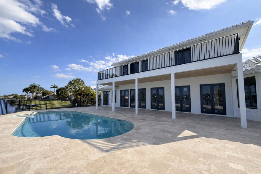 Newly renovated home situated on a rare 0.42-acre cul-de-sac, this waterfront estate offers exceptional privacy and lake views. Designed for true South Florida living, the backyard features a resort-style pool, summer kitchen, and outdoor shower-ideal for entertaining.

Inside, the home showcases a chef's kitchen, expansive living areas, club room, private gym, and a covered second-floor balcony overlooking the water. Complete with a three-car garage and over 5,000 living square feet, this move-in-ready residence delivers space, luxury, and lifestyle in one of Wellington's premier gated communities.