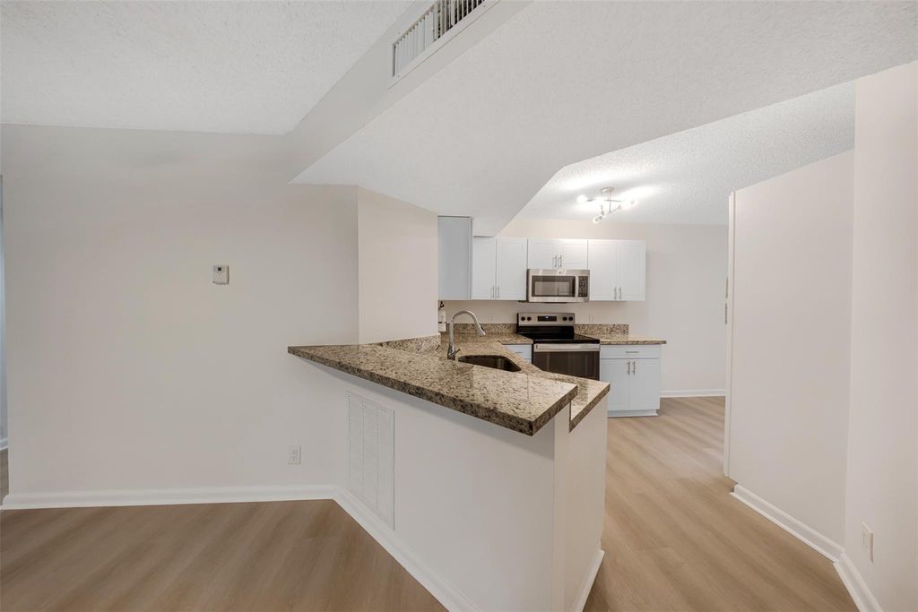 Photo of 8977 Wiles Road #102, Coral Springs, FL 33067 (MLS # F10553990)