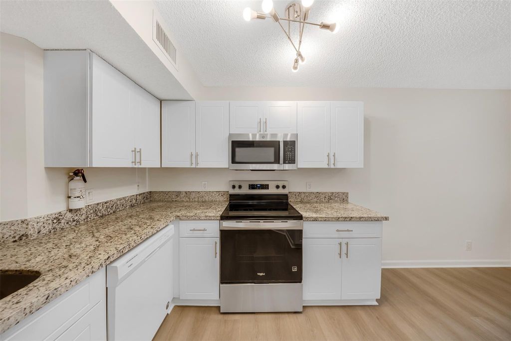 Photo of 8977 Wiles Road #102, Coral Springs, FL 33067 (MLS # F10553990)