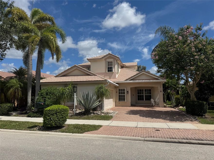 Come and explore this beautiful 4-bedroom, 3-bath pool home with 2 car side entry garage in Parkland Isles. Perfectly located in former builder model row just steps away from the clubhouse and community amenities. This spacious home features soaring ceilings, two newer A/C systems (2024), a beautifully remodeled pool (2021), and accordion hurricane shutters. Relax and entertain while taking in the serene lake views from your backyard oasis. HOA fees include Xfinity cable & internet, and ADT alarm system monitoring. This is your chance to own one of the most sought-after homes in the magnificent community of Parkland Isles located in the heart of west Parkland and centrally located between the schools.