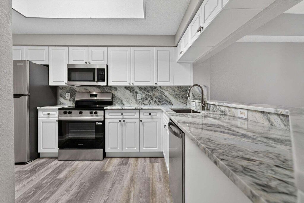 Photo of 3022 ALCAZAR Place #301, Palm Beach Gardens, FL 33410 (MLS # B26077667)