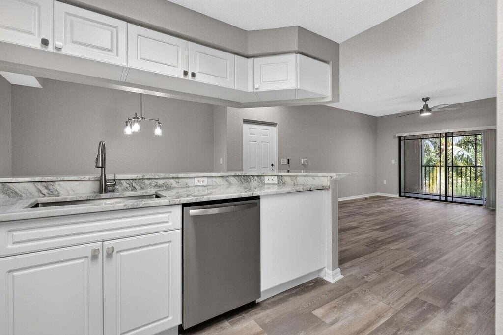 Photo of 3022 ALCAZAR Place #301, Palm Beach Gardens, FL 33410 (MLS # B26077667)