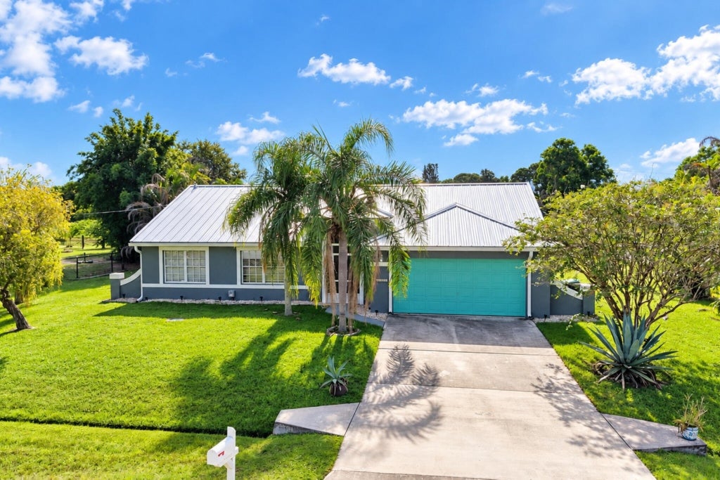 Photo of 2461 SE ROCK SPRINGS Drive, Port Saint Lucie, FL 34952 (MLS # B26076023)