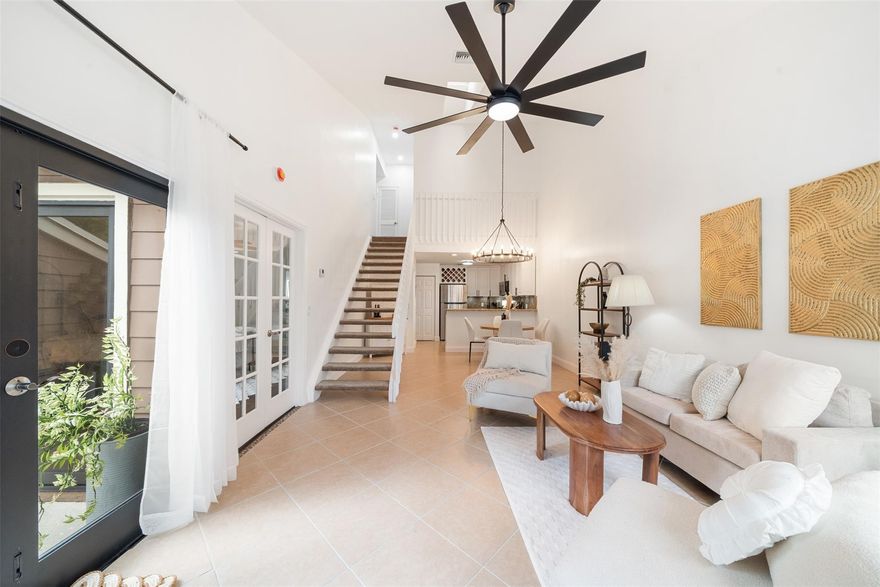 Welcome to modern living! This beautifully updated 3BR/2BA townhome features vaulted ceilings, multiple skylights, new flooring and NEW 2024 IMPACT windows and doors. Major upgrades include NEW recessed lighting, new OVERSIZED ceiling fan and matte lighting, 2025 electrical panel, and 2021 HVAC. In the kitchen, enjoy STAINLESS STEEL appliances, NEW oversized matte faucet, and breakfast bar expanding to the dining and living areas—perfect for open concept living and entertaining! The enclosed loft creates a spacious 3rd bedroom (no window) while the freshly painted walls, NEW upstairs flooring, and in-unit washer & dryer complete the modernized layout! Enjoy a fenced patio with storage closet, ideal for relaxing and hosting! All-ages community with pool, tennis courts, and LOW HOA.