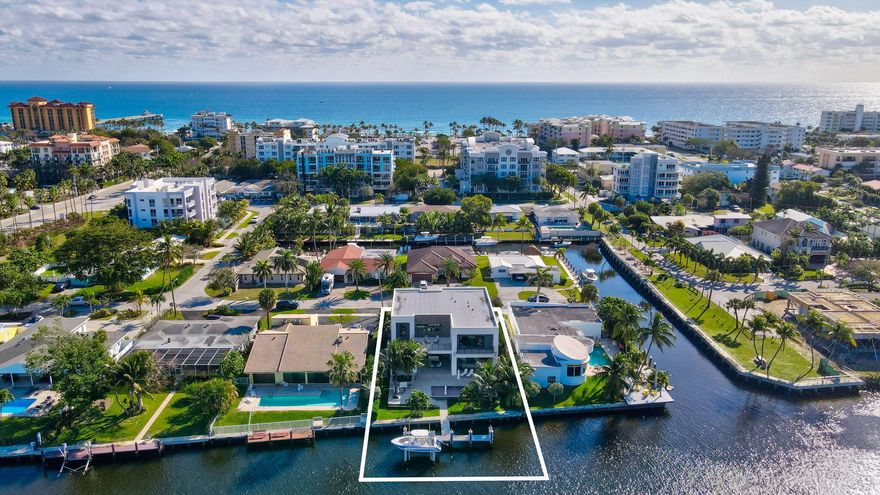 Welcome to the epitome of luxury living with this direct intracoastal contemporary estate, located on the east side of the intracoastal in a no-wake zone. Offering unparalleled views and a prime location, steps away from the ocean, & local hotspots, this property is a gem. The interior boasts an open-concept design, featuring clean lines, high ceilings, & an abundance of natural light, with water views at every turn. Equipped with top-of-the-line appliances & sleek finishes, the space is both stylish & functional. The chef's kitchen has a sixteen-foot island, two prep areas, two dishwashers, & a butler's pantry. A deck, summer kitchen, sparkling saltwater pool/spa, & eco-friendly T-dock with lift on 76 ft of water-frontage, is an outside oasis to retreat and watch the yachts go by... Take the elevator to the second floor, where you will find a media loft, three additional bedrooms, a second laundry area, and a luxurious primary suite complete with his/her walk-in closets, a spa-like oversized bathroom, a balcony, deck, and beverage center.
The estate offers multiple spacious bedrooms each with its own en-suite bathroom, ensuring privacy and comfort for all residents and guests. Every detail has been thoughtfully crafted and curated to make this home one of a kind.

Located in the prestigious Deerfield Beach Island, this coastal contemporary estate is just moments away from world-class dining, boutiques, beaches, and culture. This property is perfect for boating enthusiasts, or those who wish to enjoy the serenity and tranquility of the waterway.

Systems:

Custom Electric Shades throughout
Blackout Shades - All bedrooms
Sheers - Living Room, Dining Room & Loft
Custom Recessed Lighting, Sconces, Fixtures, and Chandeliers
Full Home Generator Installed
Pre-Wired for Sound System/Media
Cameras Installed Interior & Exterior for Professional Alarm
Monitoring
Pool - Heated, Salt Chlorination, Deck Jets, Lights, Bubblers, and
Spa
AC Zones; 3 Carrier Air Handlers
Closets - Custom Fit and Completed Throughout
Solid Wood Doors
Toto Toilets
2 Car Garage - Epoxy Finished with Storage
Covered Loggia with Summer Kitchen/BBQ (Propane)

Main Highlights:

Open Concept Coastal Contemporary Design
Chef's Kitchen with Dual Prep Areas, Dishwashers, and Sinks
High-end Appliances - Subzero, Wolf, Zephyr, Fisher & Paykel
Generator
Elevator
Main Level Guest Bedroom/Office
Cabana Bathroom
Dual Laundry Areas
Custom Closets
Custom Electric Shades
Large Spacious Bedrooms with En-suite Bathrooms
Butler's Pantry
Dual Temperature Controlled Zephyr Professional Wine Cooler
Multiple Outdoor Sun Decks
Multiple Balconies
Saltwater Pool with Spa, Sun Shelf, Bubblers, and Deck Jets
Eco-friendly T-Dock with 20,000 pound capacity Boat Lift
Located on 76 feet of direct East Intracoastal Water-frontage
Walking distance to Beach, Restaurants, and Boutiques

Offered Unfurnished. Furnishings available and negotiable ONLY on
a separate bill of sale.

To Note:
Seawall is an original T piling and concrete panel seawall that has
been repaired/reinforced along the waterside with concrete batter
piles (total of 9) and a 41" wide x 20" thick concrete cap. The wall is
76 linear feet long and is 6'7" tall measuring from the berm. This is
a huge benefit of a new construction home.

**Now offered inclusive of new designer furnishings**