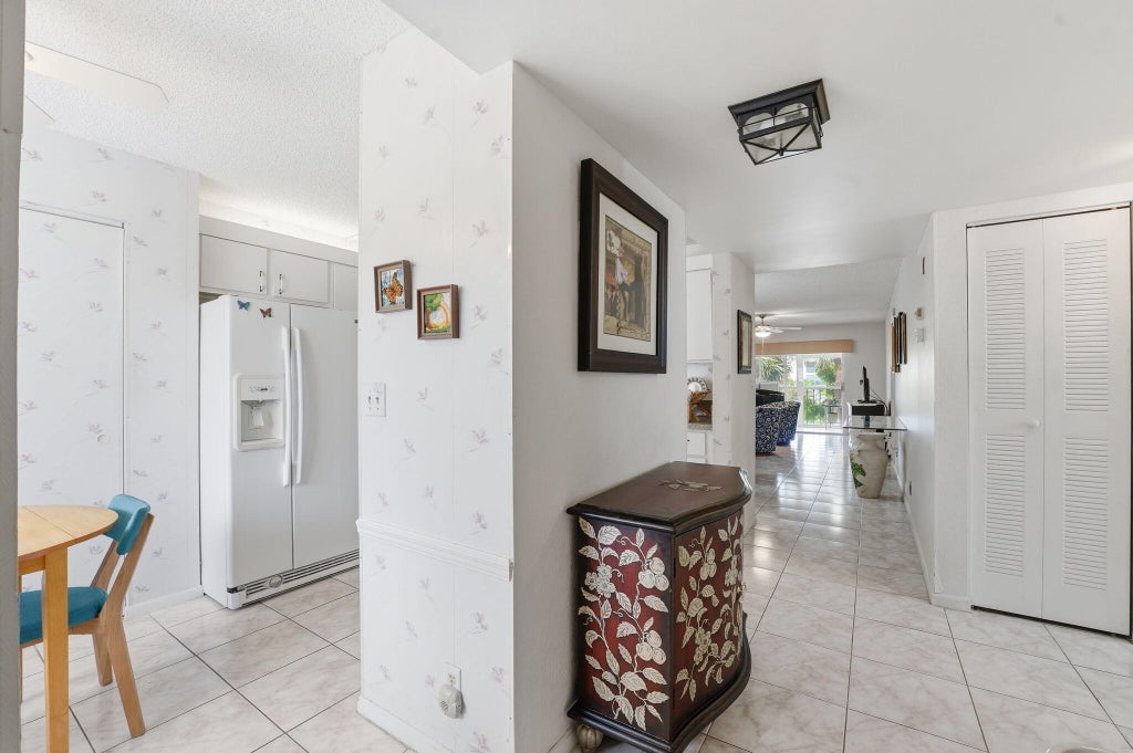 Photo of 3146 Via Poinciana #307, Lake Worth, FL 33467 (MLS # B26038386)