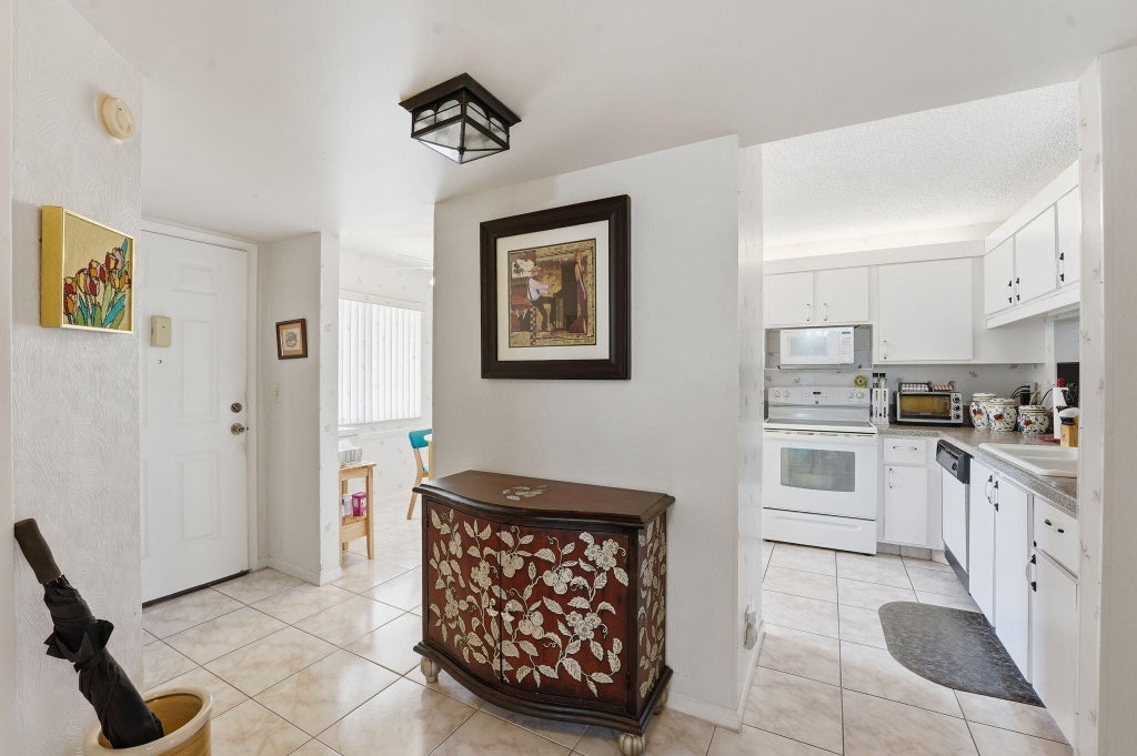 Photo of 3146 Via Poinciana #307, Lake Worth, FL 33467 (MLS # B26038386)