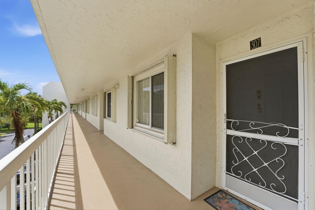 Photo of 3146 Via Poinciana #307, Lake Worth, FL 33467 (MLS # B26038386)