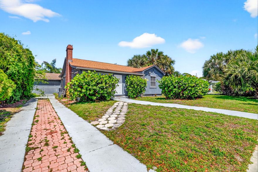 Fantastic opportunity in one of the most desirable areas of West Palm Beach! This beautiful multifamily-zoned property offers incredible flexibility for investors or owner-occupants and is ideal as an Airbnb or primary residence. Featuring a 2021 roof for added peace of mind, the front home offers a converted 3-bedroom, 2-bath layout with bright, spacious living areas. The updated kitchen is designed to impress with solid wood shaker-style cabinetry, granite countertops, stainless steel appliances, and a custom backsplash. Bathrooms have been tastefully renovated with Carrera marble shower tile, modern vanities, and brushed nickel finishes. A separate rear 1/1 cottage includes its own private entrance and a fully fenced backyard,perfect for guests, extended family, or generating rental  income.  Enjoy Florida living at its best with a stunning pool area and an oversized screened-in patio, offering plenty of space to relax or entertain year-round. Conveniently located near shopping, dining, beaches, and major roadways, this property truly has it all.Don't miss this exceptional opportunity to own a versatile property in a prime location.