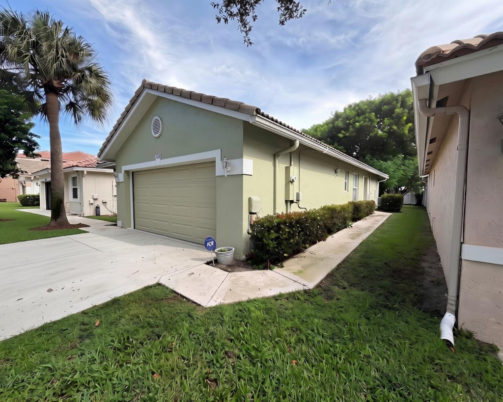 Photo of 3703 NW 63RD Court, Coconut Creek, FL 33073 (MLS # B26072316)