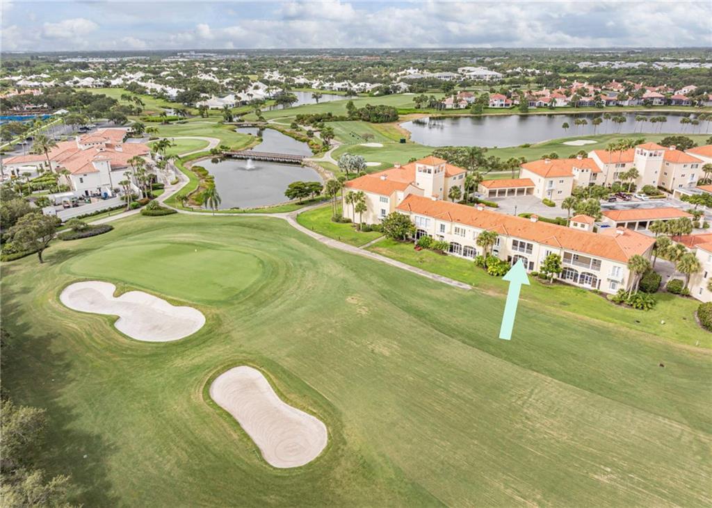 Sweeping golf views from this pied-a-terre in prestigious guard-gated Grand Harbor community! Lovely space with newer impact windows features a private balcony overlooking the greens, in-unit washer and dryer & access to community pool. Convenient location close to beach, shopping, medical and river. Open-concept layout with French doors leading to an inviting outdoor area perfect for alfresco evenings and effortless entertaining. Make this your private residence, home-away-from-home, summer getaway or use as a terrific investment property with great rental flexibility.