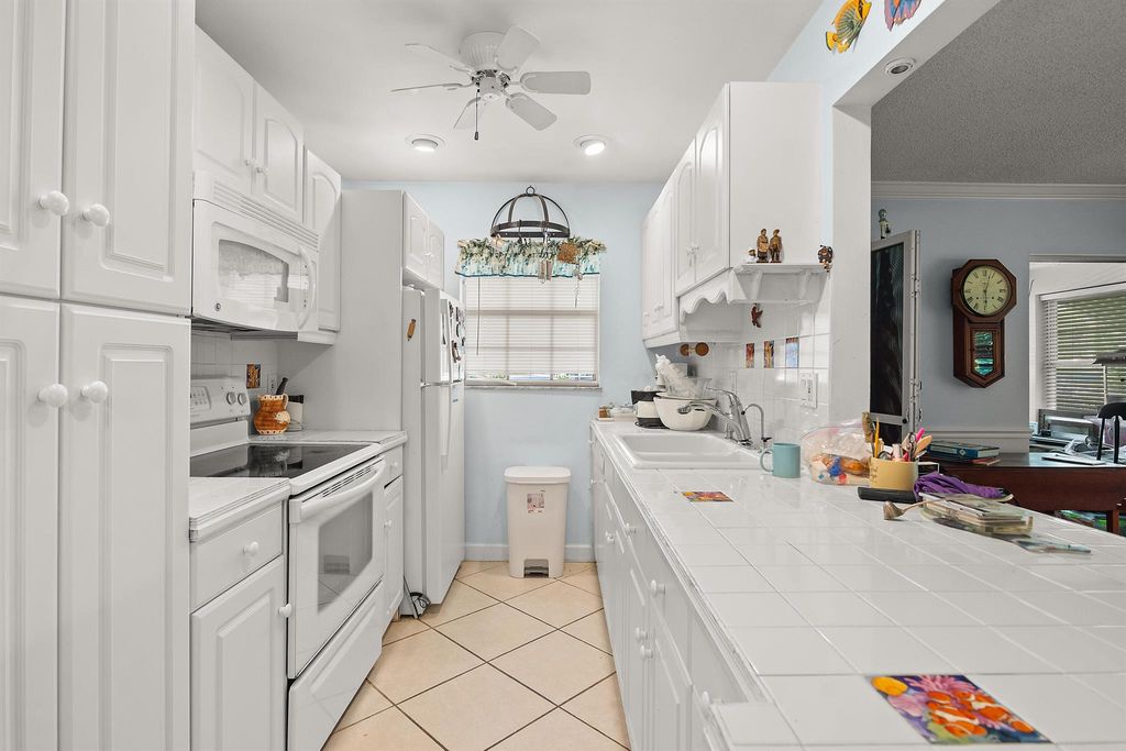 Photo of 906 Savannas Point Dr, Fort Pierce, FL 34950 (MLS # R11097641)