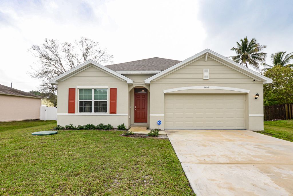 Photo of 2402 SE Gillette Avenue, Port Saint Lucie, FL 34952 (MLS # R10950860)