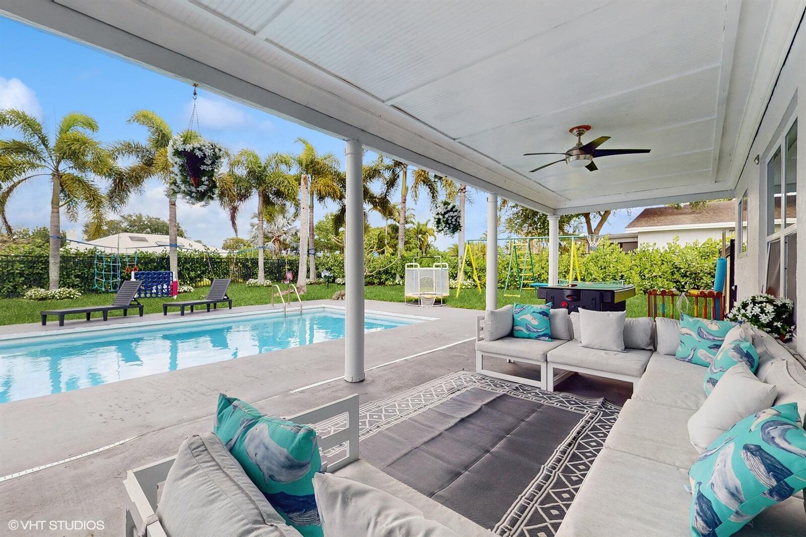 Beautifully renovated 5/3 house with big pool and huge yard with a lot of amenities for kids and adults. Outside fireplace and hot tub give you relax after busy day. The large, covered porch provides an optimal outdoor relaxation space. The pool adds an extra layer of luxury and entertainment potential. Overlooking a canal, the house enjoys serene views and privacy.