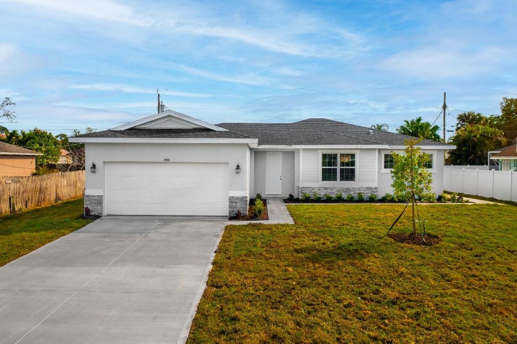 Photo of 1556 SW Birkey Avenue, Port Saint Lucie, FL 34953 (MLS # R10953190)