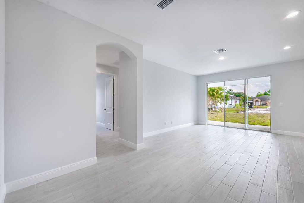 Photo of 1556 SW Birkey Avenue, Port Saint Lucie, FL 34953 (MLS # R10953190)