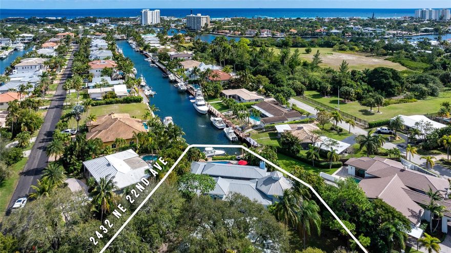5 min to the ocean with no fixed bridges! This 4BR/4BA waterfront home in sought-after Lighthouse Point offers deepwater dockage and long, unobstructed canal views toward the Hillsboro Inlet. Designed for seamless indoor-outdoor living, the light-filled layout features two primary suites, expansive living areas, and a large kitchen opening to the family room—all oriented to capture stunning water views. Enjoy a private tropical backyard with a remodeled heated saltwater pool/spa, cabana bath, and newer polymer dock with 16K-lb lift. Zoned A/C, oversized bedrooms, and a 2-car garage complete this exceptional boating opportunity in one of South Florida's premier waterfront communities.