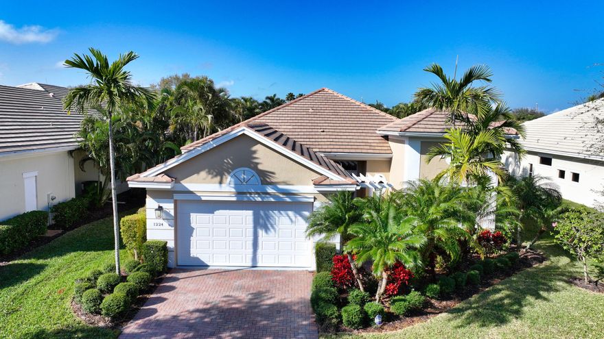 Coastal charm meets effortless living in this one-of-a-kind, move-in ready 3bd/3ba/2cg home! Soaring ceilings, elegant built-ins, plantation shutters, & impact windows create a light, breezy feel. The spacious owner's suite offers a tray ceiling, custom his/her walk-in closets, & a spa-like bath. Bdrm 2 features a private bath; Bdrm 3 includes a WIC.  Unwind year-round on the screened lanai w/serene lake views, heated pool, & spa.  Home boasts an S-tile roof & paver driveway designed for lasting durability.  Located in a gated community w/amenities, just minutes to pristine beaches & more.