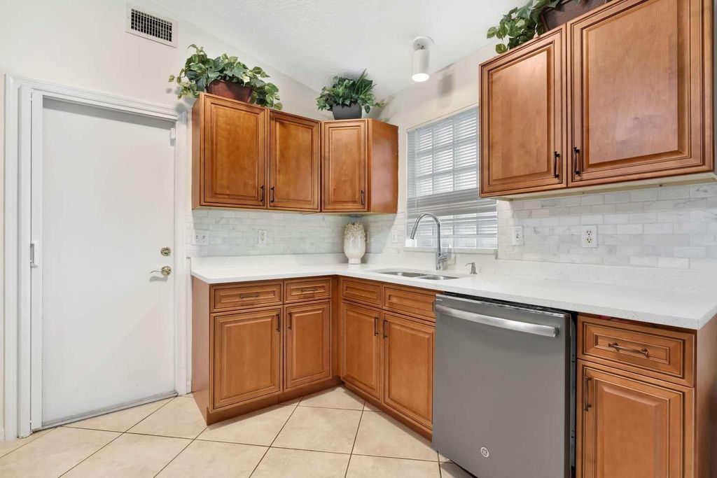 Photo of 1002 Aspri Way, Riviera Beach, FL 33418 (MLS # F10536039)