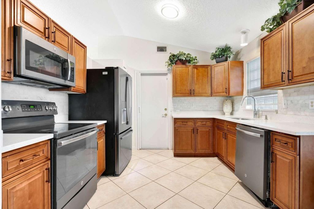 Photo of 1002 Aspri Way, Riviera Beach, FL 33418 (MLS # F10536039)