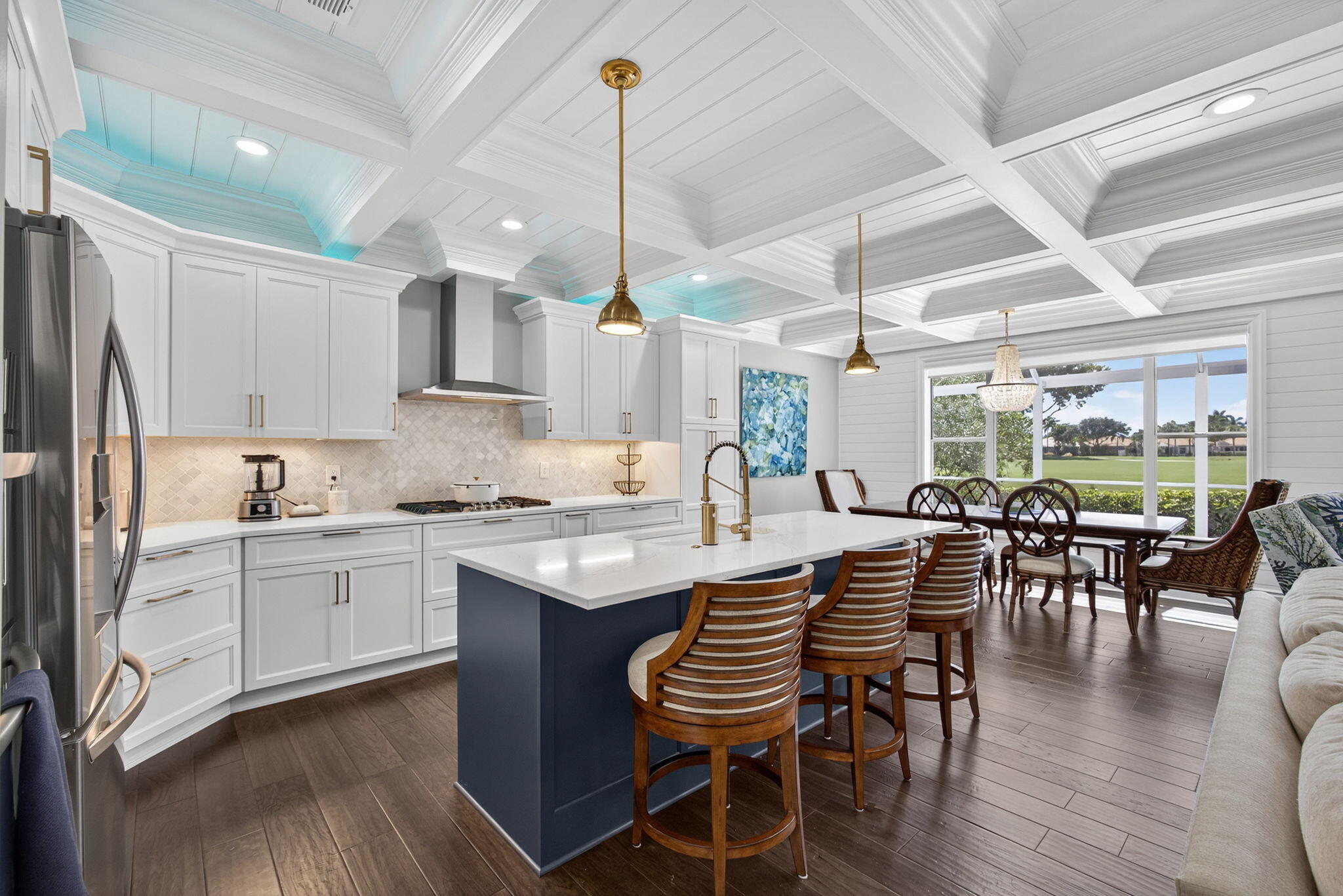 Completely renovated in 2021, this fabulous two-story home radiates modern coastal elegance. The main level features a private master suite with a spa-inspired ensuite, while upstairs offers two spacious bedrooms and a versatile loft. Soaring coffered ceilings, designer lighting, and an open, airy layout fill the home with incredible natural light and a breezy coastal vibe. High-end finishes and thoughtful details are found throughout, creating a sophisticated yet comfortable atmosphere. Enjoy breathtaking water and golf course views from nearly every room, then stroll to the clubhouse to experience the world-class amenities at The Club at Ibis. Move-in ready and tastefully reimagined, this home is truly a showpiece. Located in the NW corner of WPB, only 20 min from PBIairport.