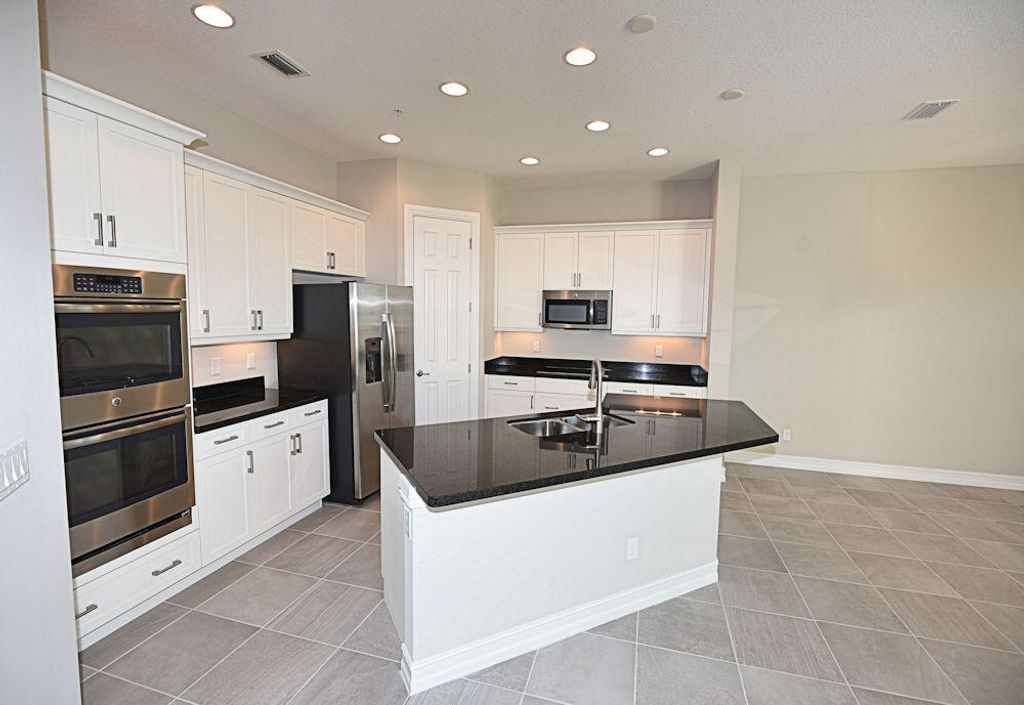 Photo of 1908 Juno Landing Lane, North Palm Beach, FL 33408 (MLS # R10965925)