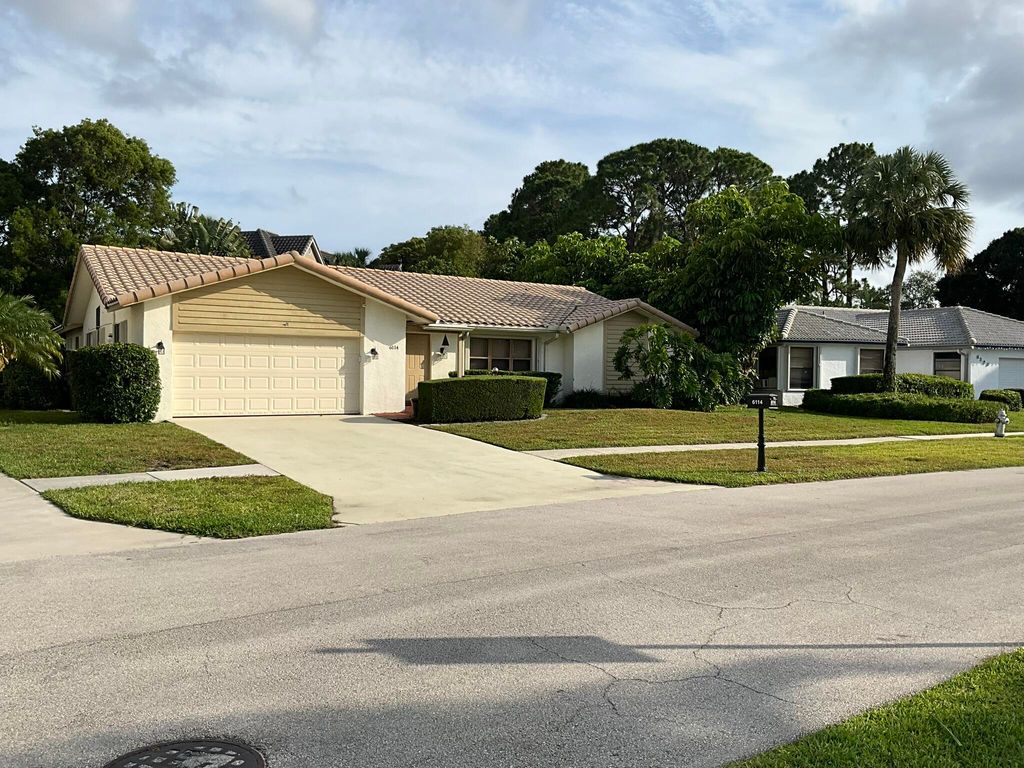 Photo of 6114 Woodbury Road, Boca Raton, FL 33433 (MLS # B26024602)
