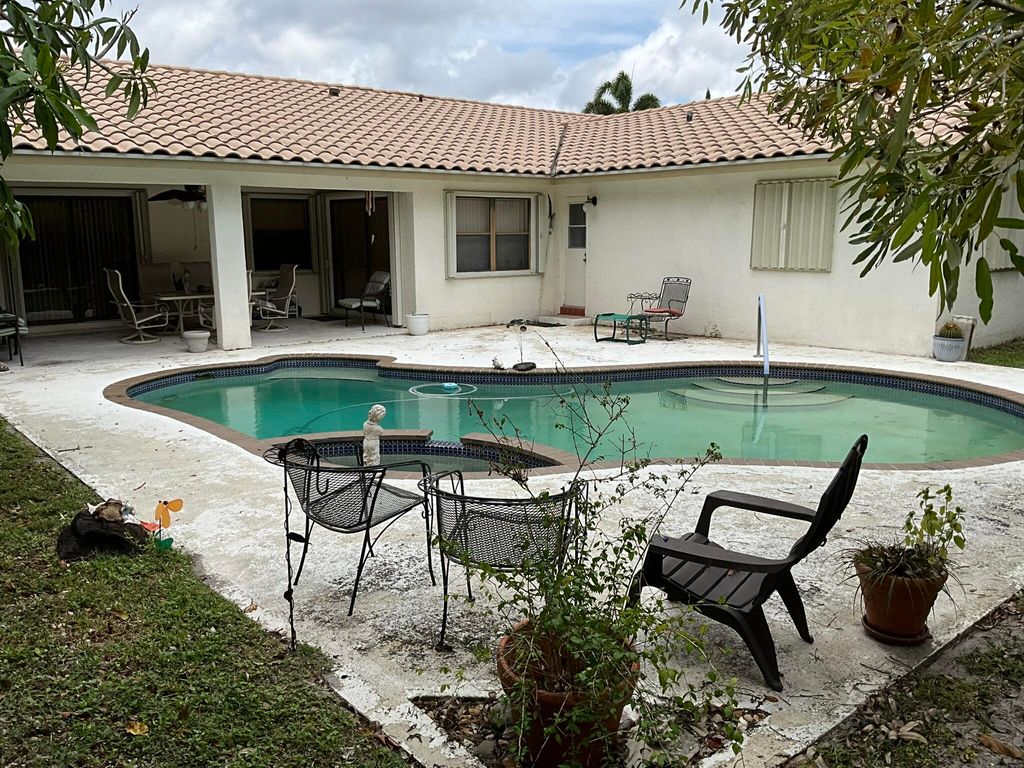 Photo of 6114 Woodbury Road, Boca Raton, FL 33433 (MLS # B26024602)