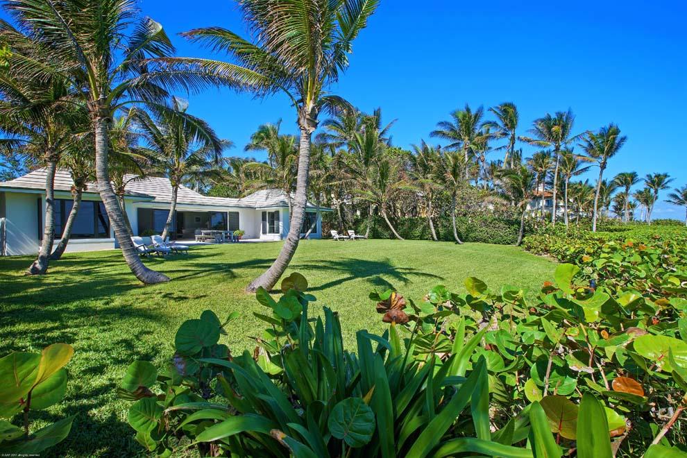 A serene and private oceanfront property awaits at 3377 North Ocean Boulevard, Gulf Stream, Florida. Situated on over one acre with 100 feet of oceanfrontage and 145 feet on A1A, this seaside oasis boasts tranquil ocean views amidst palm trees, seagrapes and manicured green lawns. Enter the residence through a Zen-like garden with lemon trees, pond with water fountains and coral stepping stones that gently lead to the main entrance. The courtyard unveils the picturesque pool and terrace providing the first peak of the ocean through the home's bay window. Featuring cypress paneling and terracotta tile, the home has an open and flexible floor plan. Enjoy the current residence, renovate to your liking or build a masterpiece oceanfront estate. The possibilities and ocean views are endless.