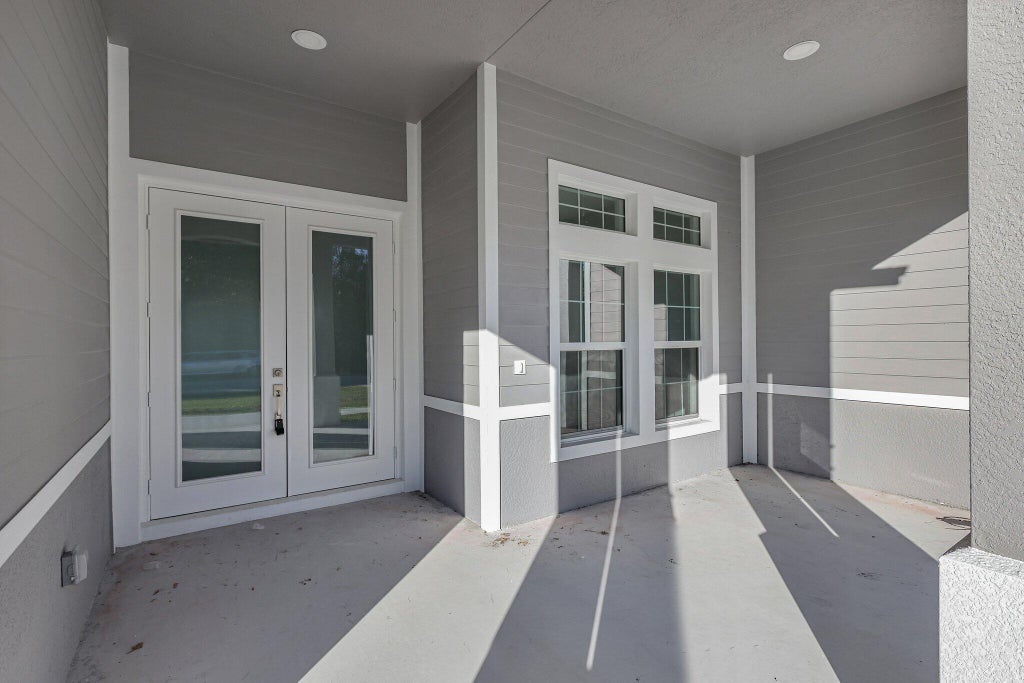 Photo of 1791 SW Effland Avenue, Port Saint Lucie, FL 34953 (MLS # B26038110)