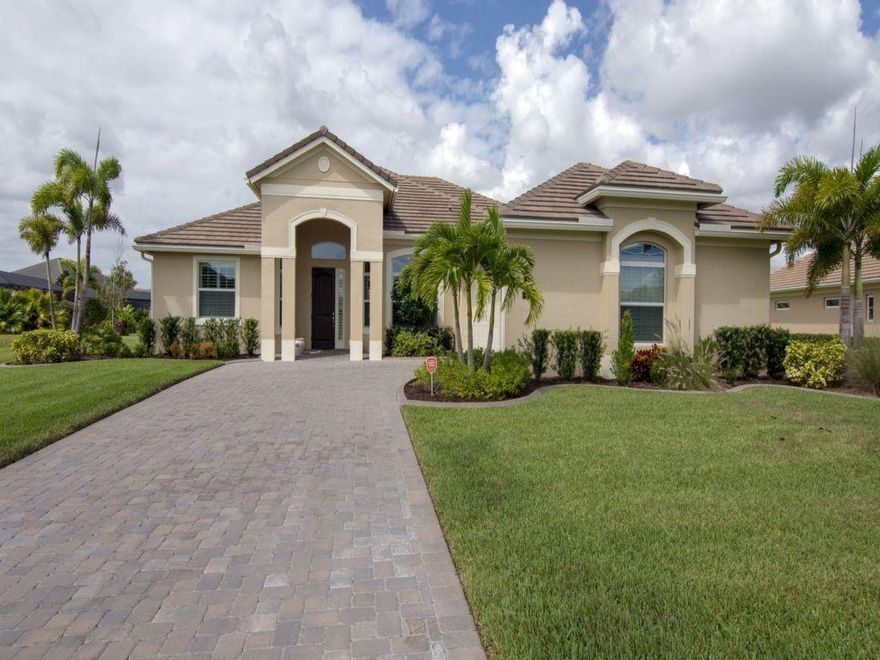 This 2016 home is clean and ready to move in. Large 1/3 Acre Lot with Lake View.  2.5 Garage, Impact Glass, Custom Closets, Plantation Shutters, A/C Storage and more.  MUST SEE! Beautiful upscale gated community close to shopping, dining and movies.