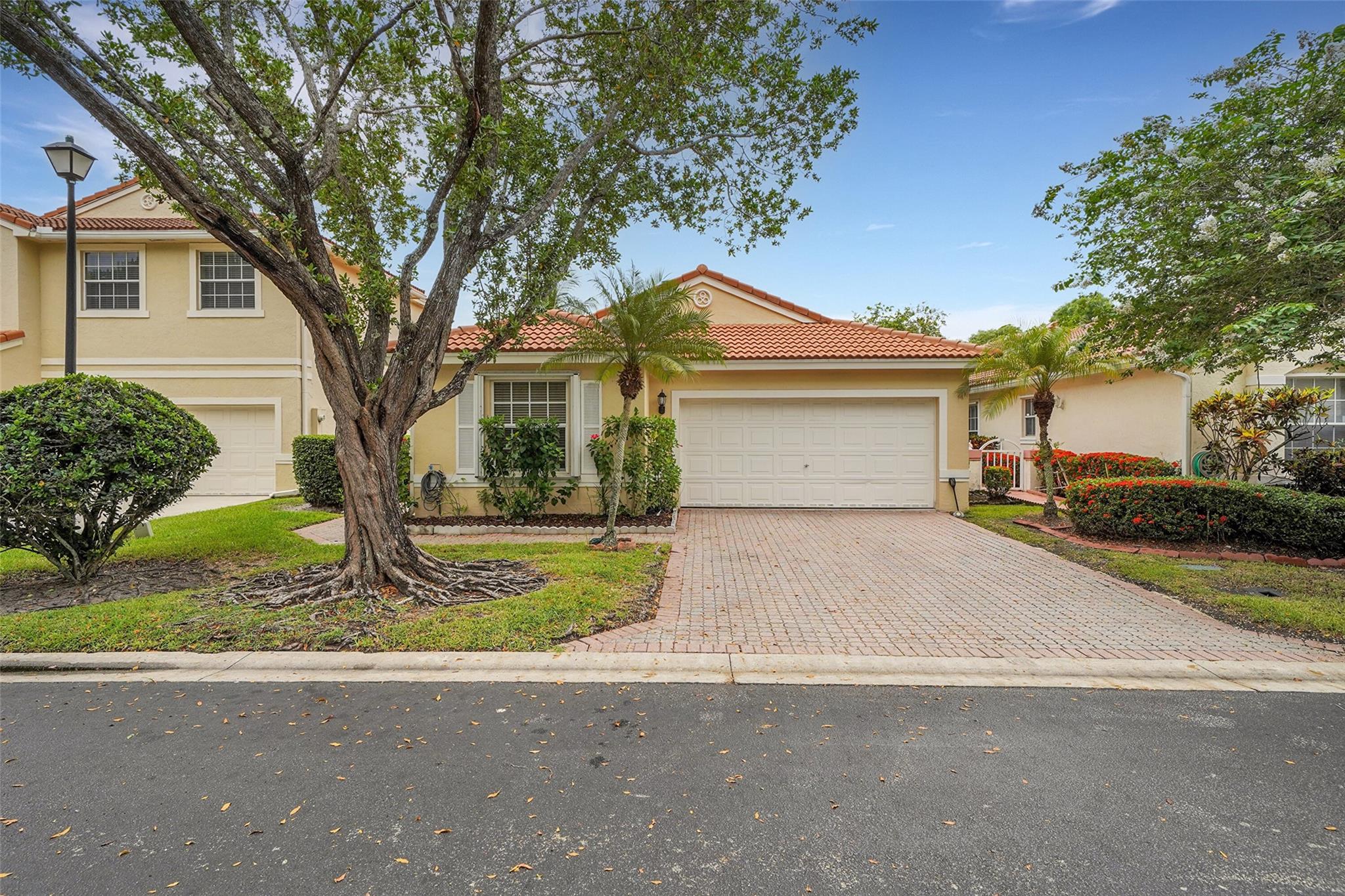 Updated & Move-In Ready! Stunning 3-bedroom, 2-bathroom, 2-car garage home located in the gated community of Kensington Green. Enjoy your private gated front entrance with accordion shutters throughout. Step inside to an open-concept layout featuring sleek 36x36 porcelain tile flooring, soaring ceilings, and a spacious living area that seamlessly connects to a beautifully renovated kitchen with Samsung appliances, soft-close cabinetry, and ample storage. Both bathrooms have been tastefully updated with dual sinks and modern finishes. Zoned for top-rated schools and just minutes from shopping, dining, parks, and major highways. Low HOA in a quiet, well-maintained, family-friendly community. This home checks all the boxes—don’t miss your chance!