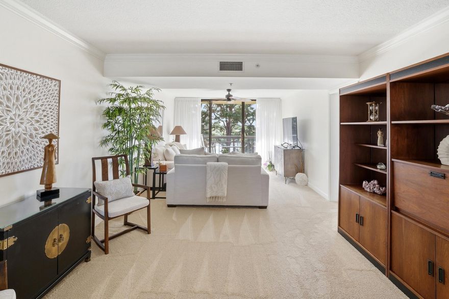 Positioned within one of Jupiter's most established waterfront communities, Residence 404 at 2101 Marina Isle Way presents an opportunity to own a marina-front condominium defined by light, elevation, and everyday coastal ease. Located on the fourth floor within Marina at the Bluffs, this residence captures wide marina views and steady ocean breezes while maintaining a comfortable connection to the waterfront setting below. From the moment you enter, natural light sets the tone. Expansive sliding glass doors frame the terrace and invite soft coastal brightness throughout the main living areas. The living and dining spaces connect effortlessly, creating an environment that feels open yet appropriately scaled for daily living and entertaining.  The flow is natural and practical, offering flexibility without wasted space. The private balcony extends the interior outdoors, providing uninterrupted marina views and a peaceful vantage point above the activity of the docks. Mornings begin with sun reflecting across the water, while evenings bring a calm glow as boats settle in for the night. The fourth-floor elevation enhances both privacy and perspective, allowing you to enjoy the movement of the marina without sacrificing tranquility. The kitchen is efficiently positioned to remain connected to the main living area. Cabinetry and counter space are thoughtfully arranged for functionality, offering practical storage and workspace for everyday use. The adjacent dining area accommodates both casual meals and more formal gatherings with ease. The primary suite is generously sized and privately situated, creating a comfortable retreat within the residence. Ample closet space and an en-suite bath provide both convenience and privacy. The second bedroom offers flexibility for guests, a home office, or additional family space, and is complemented by a second full bath accessible from the main living areas. This property is offered for sale and presents an excellent opportunity for a primary residence or long-term investment within a well-managed waterfront community. The building's fourth-floor position enhances natural light exposure and maximizes the marina outlook while providing convenient access to amenities. Residents of Marina at the Bluffs enjoy meticulously maintained grounds, a waterfront community pool, tennis courts, and landscaped walking paths. The marina setting delivers a relaxed coastal atmosphere while maintaining a sense of structure and security within the condominium association. The location further elevates the appeal. Just minutes from Jupiter's beaches, dining, shopping, and local parks, the address provides access to the best of the area without compromising quiet waterfront living. Close proximity to the Intracoastal Waterway and Jupiter Inlet enhances the overall lifestyle for those drawn to boating and water activities. What defines Residence 404 is balance. It offers waterfront living without the maintenance demands of a single-family home. It delivers elevation and privacy while remaining visually connected to the marina environment. It combines practicality with scenic value in a way that feels authentic and grounded.  2101 Marina Isle Way #404 represents a strong ownership opportunity within one of Jupiter's most desirable marina-front communities, where light, water views, and location align to create a property that is both livable and lasting.