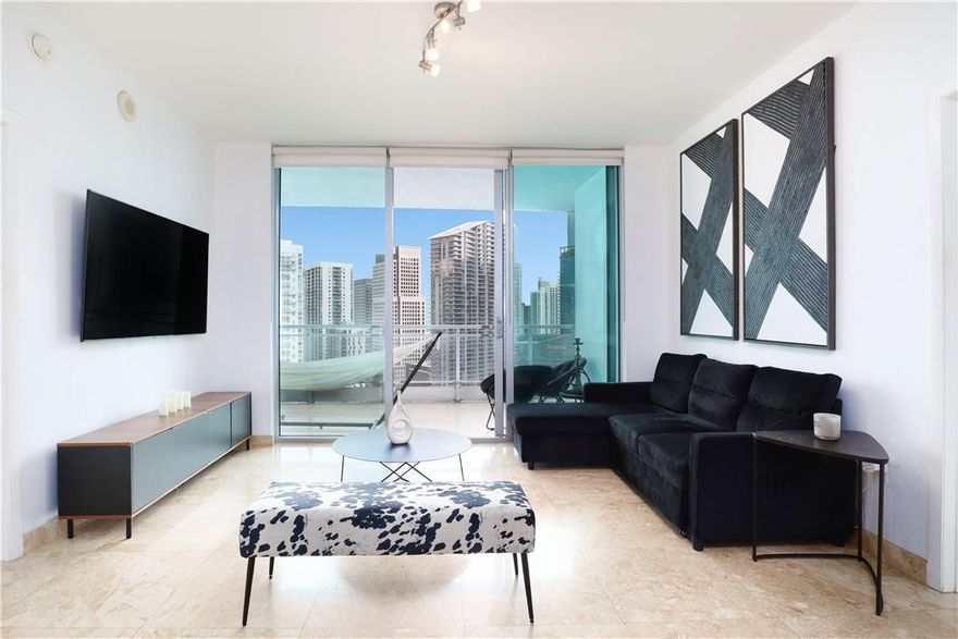 Wake up every morning to the BEST PANORAMIC VIEWS of Brickell, Miami River, Ocean & City, 2/2 Unit for rent in The Ivy! Porcelain Floors throughout with SS Appliances & W/D in the Unit! Club House, Heated Pool,  Fitness Rooms, Business Center, Spa, 24 Hour Valet, Best Amenities a building could offer! Minutes away from the Brickell City Centre, Restaurants, Bars, Convention Center, Museums, Arena, And Five Minutes from Miami Beach. (Rent includes wifi, HOA, Cable Tv & Parking)