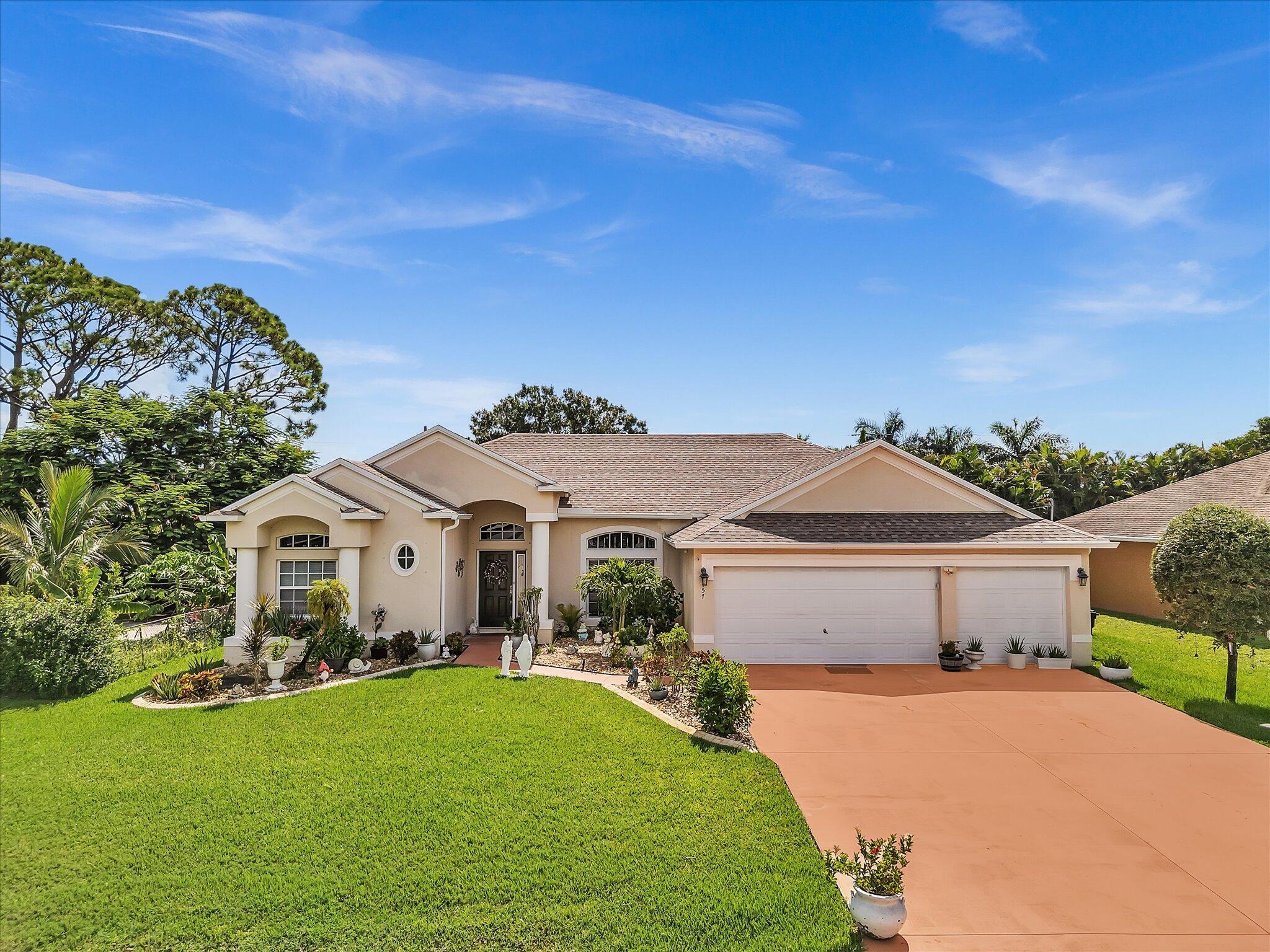 Sparkling Port St. Lucie Pool Home with Modern Upgrades & No HOA Fees!This stunning 4-bedroom, 3-bathroom, CBS construction home boasts an expansive open floor plan and features 10-foot ceilings and gorgeous 24'' marble tile flooring throughout.The split master bedroom provides a private retreat, featuring his and hers walk-in closets and a luxurious master bath with double sinks, a shower, and a soaking tub.Step outside to your very own private oasis. The screened lanai provides a perfect space to relax by the concrete pool, with an under-roof patio for shaded enjoyment!This home is located on a generous 10,000 sq ft lot and is distinguished by its attached 3-car garage!!Schedule your private showing today!''