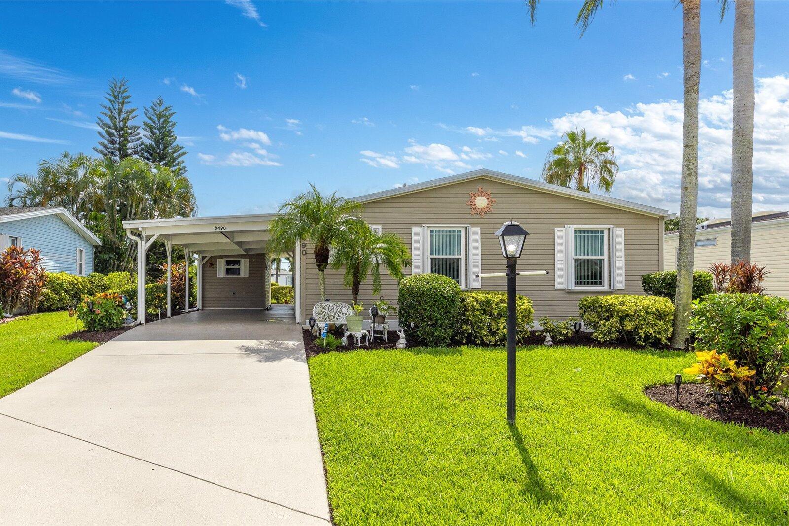 Enjoy Florida living in this beautifully maintained LAND OWNED 2 bedroom, 2 bath lakefront home in the amenity-rich, 55+ community of Savanna Club! Home offers a new roof, gutters, A/C, HWH, insulated windows, acc. shutters, updated plumbing and 4th wall carport construction for peace of mind. Interior updates include laminate and tile flooring, Corian countertops, updated appliances and home is partially furnished. The enclosed lanai opens to a large covered patio, perfect for outdoor living and entertaining. Resort-style amenities include an onsite restaurant, golf, 3 pools, tennis, pickleball, 3 fitness centers, 2 clubhouses, 10,000 SF theatre, activities & more. This home blends comfort, convenience, and the desirable Savanna Club lifestyle.