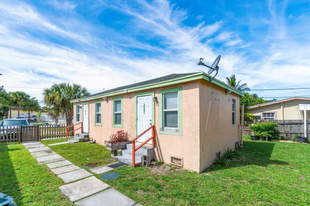 Photo of 320 Swain Boulevard, Greenacres, FL 33463 (MLS # B26017653)