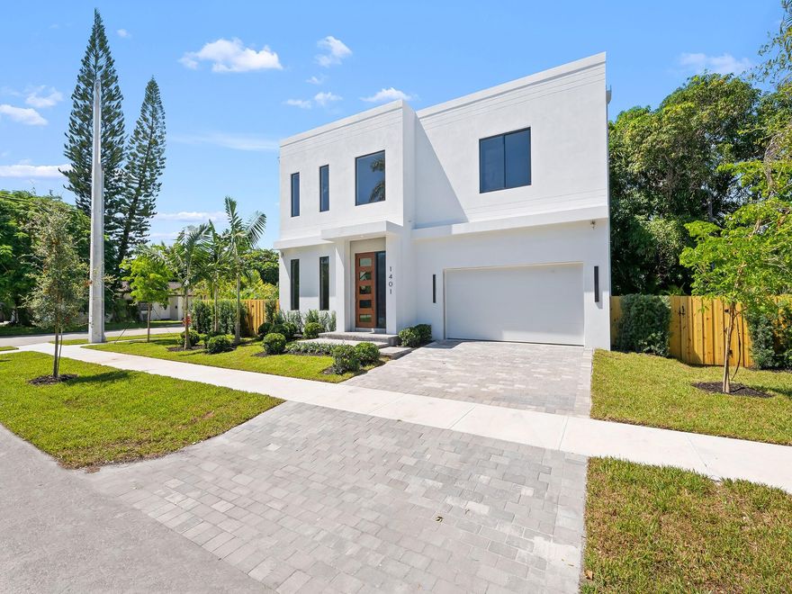 NEW CONSTRUCTION | Inspired by contemporary design & architecture in E. Fort Lauderdale's subdivision of Poinsettia Heights. Walls of glass illuminate the open concept design & 2 story home office conducive to today's lifestyle. The culinary kitchen offers upgrade appliances, tremendous storage & a large center island for casual meals & entertaining. The great rm opens onto a lrg side yard with a pool & patio area ideally positioned for sun & tropical breezes. The spacious primary suite boasts a lrg walk-in closet & lavish bathroom with dual sinks, oversized shower, soaking tub & water closet. 2 additional bedrms share a full bathrm. Conveniently located 2nd floor laundry rm. Oversized 2 car garage provides additional space for storage. Mins to shopping & restaurants. Sq Ft from architect