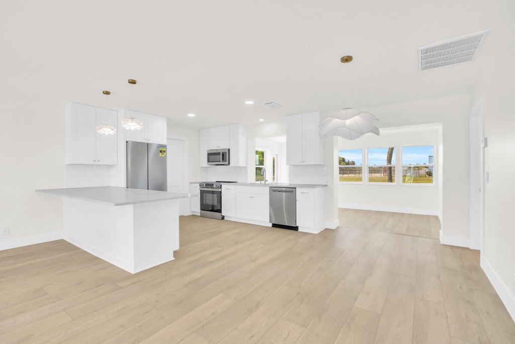 Photo of 400 Riverside Drive, Palm Beach Gardens, FL 33410 (MLS # R11100360)