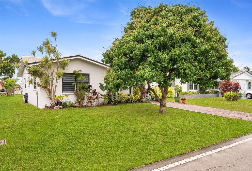 Photo of 5713 NW 84th Terrace, Tamarac, FL 33321 (MLS # B26009503)