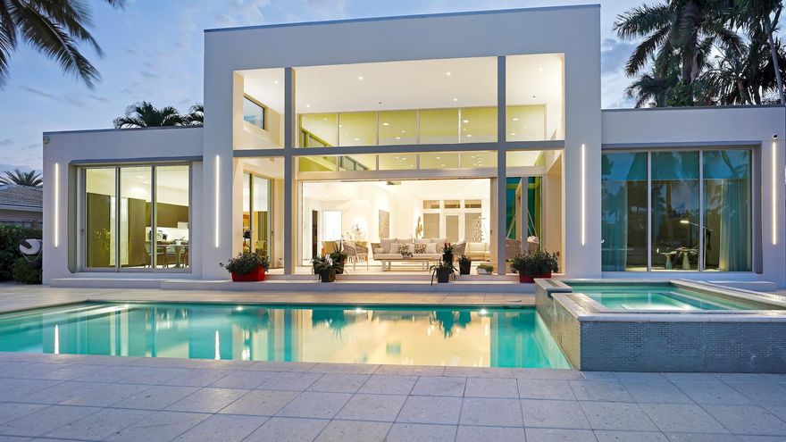 Seven Isles Las Olas! Designed by architect John Gerra. Gerra's blended materials creating spaces w/ natural light. Reglet base & door framing. A single-level pool deck extends to the concrete-pavered dock. Motorized shades, Crestron control, SieMatic German cabinetry cabinetry, Sub-Zero/Wolf appliances, tankless gas water heaters, natural gas cooking + generator, whole-house water filtration & an epoxy decked oversized garage.