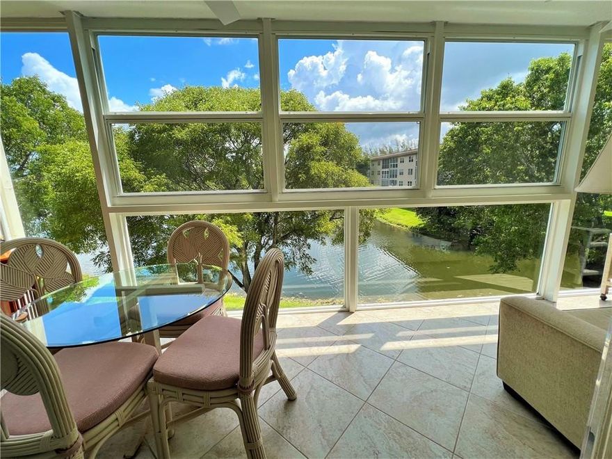 WASHER/DRYER DELUXE with LAKE/FOUNTAIN/POOL VIEW from the HURRICANE GLASS ENCLOSED PATIO Plus REMODELED KITCHEN with GRANITE/TILE BACKSPLASH, HIGH-HAT LIGHTING and CROWN MOULDING. TILE ON DIAGONAL THRU-OUT Except Bedrooms. REMODELED BATHROOMS with GRANITE and ROLL-TOP SEEMLESS SHOWER DOORS. A/C 2019. HURRICANE GLASS FRONT DOOR Plus ACCORDIAN SHUTTERS and PLANTATION SHUTTERS on Front Windows. BUILT-IN DESK AND MURPHY BED in Guest Bedroom. FURNITURE INCLUDED Except OWNER OPTION for Pictures, Bric-A-Brac, Both Bedroom Table Lamps and Contents of Cabinets, Drawers, Closets, Inside Furniture and Counters. ASSOCIATION REQUIRES ONE OCCUPANT 55+ WITH 20% DOWN AND WYNMOOR INCOME FORMULA PLUS A CREDIT SCORE OF 700 PLUS $250 REFUNDABLE MOVE-IN FEE. Information Deemed Reliable but, Not Guaranteed.
